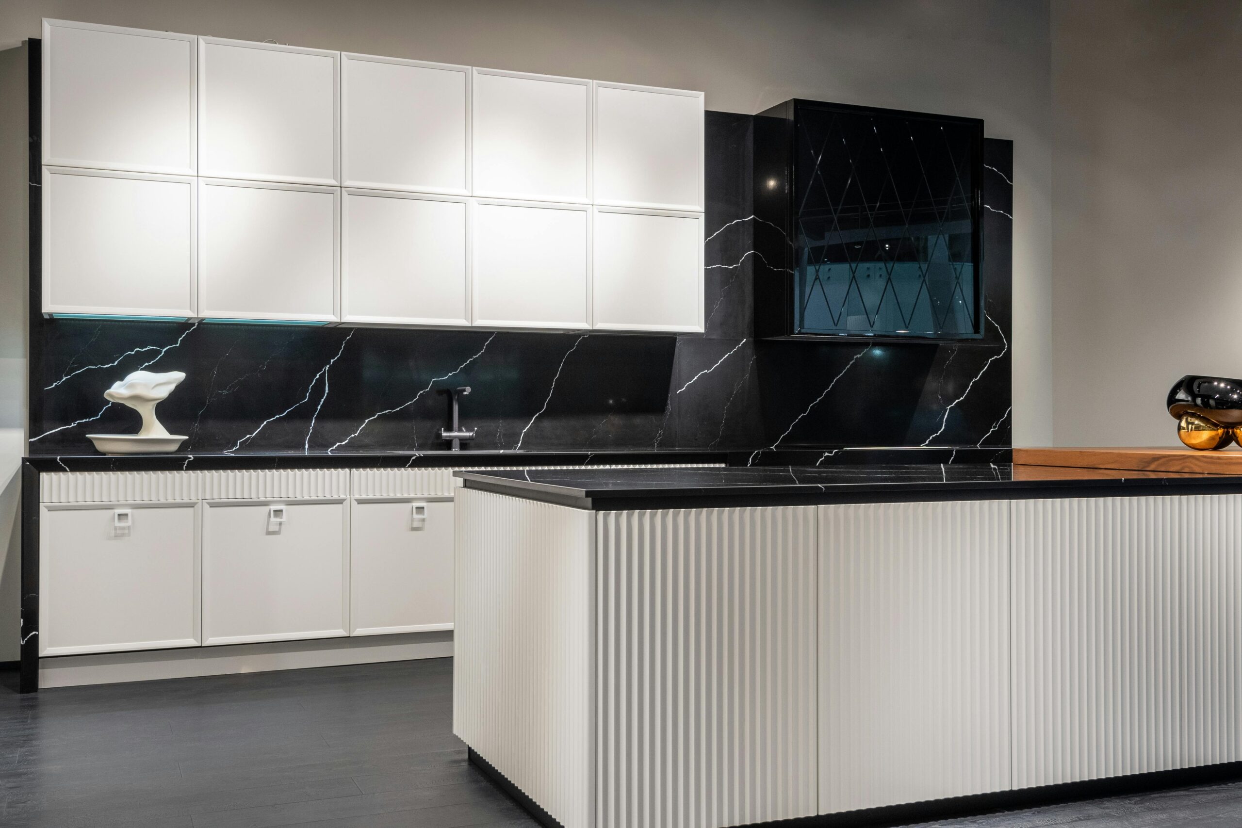 Trendy kitchen interior with white and black furniture