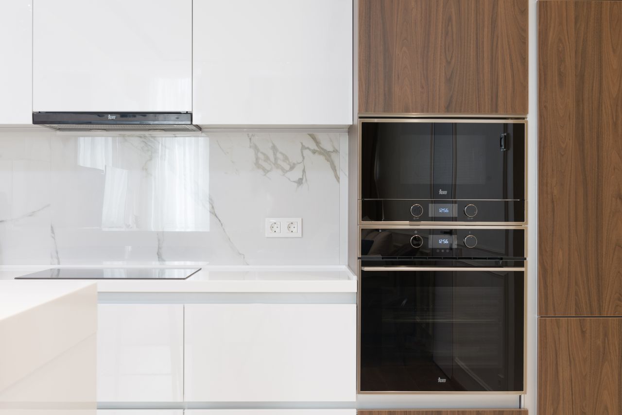 Contemporary kitchen interior with sleek appliances and stylish wood accents